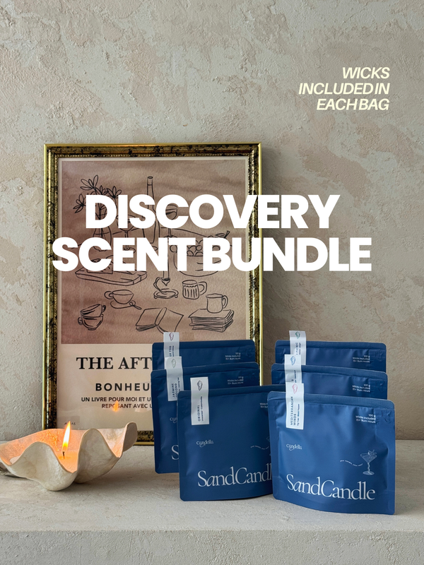 SandCandle discovery scent bundle with blue bags and a framed artwork on a neutral background.