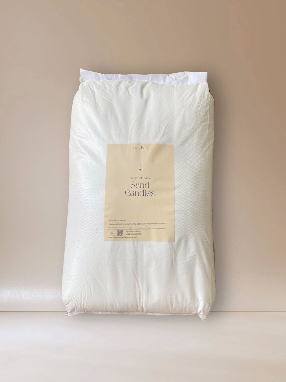 A large white 25kg bag of sand candle wax labeled 