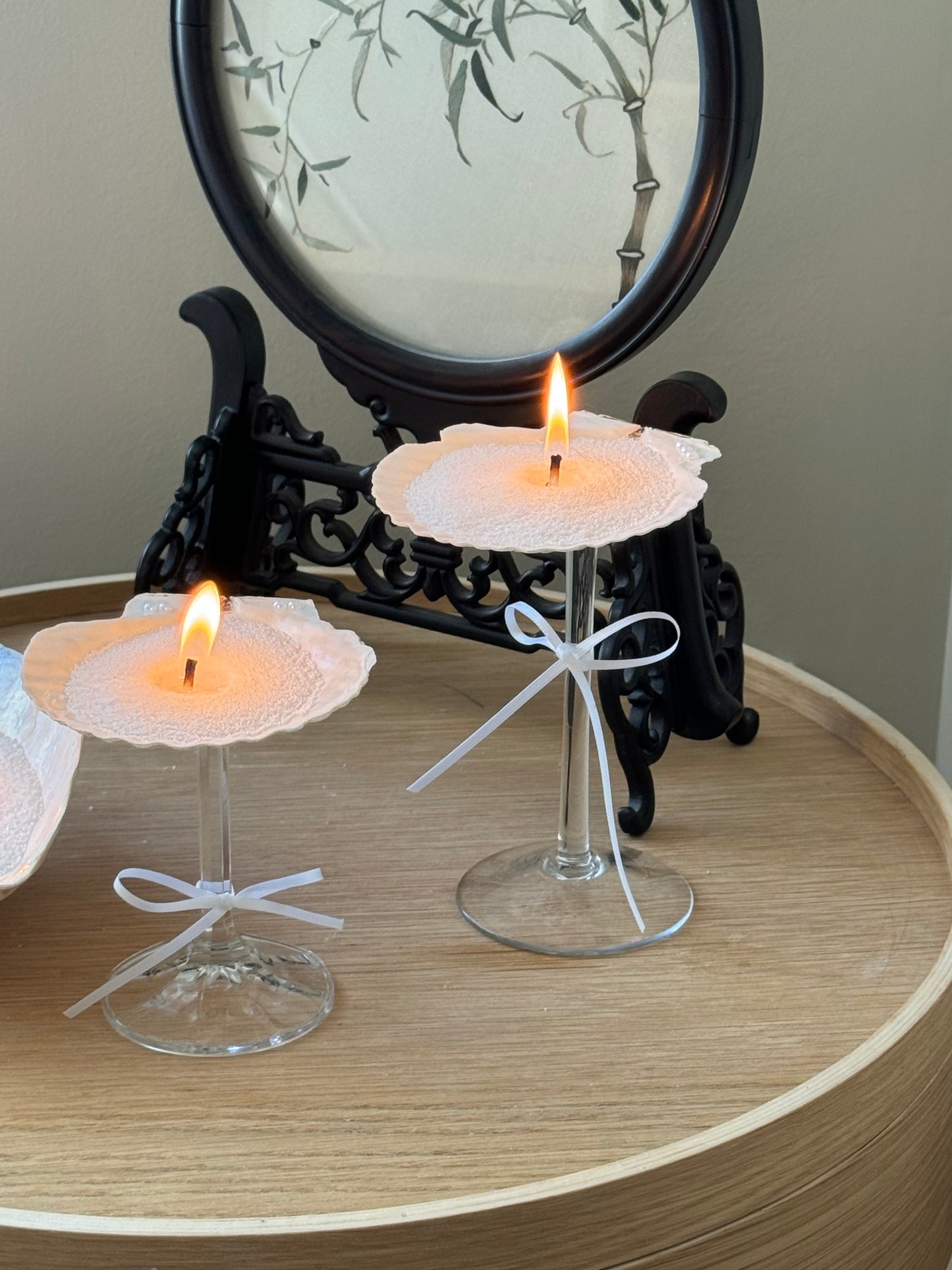 candellas sand candle lighting in two seashell martini.